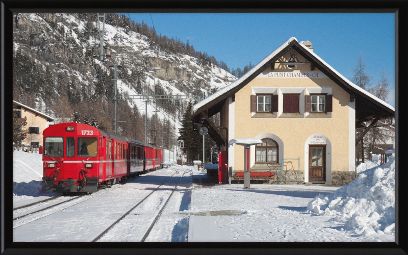 A Train Going Past a Station in Switzerland - Great Pictures Framed