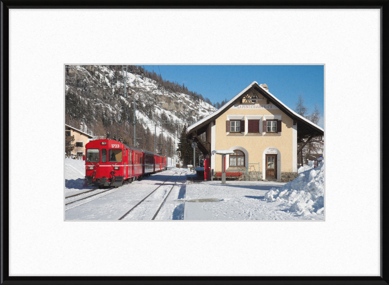 A Train Going Past a Station in Switzerland - Great Pictures Framed