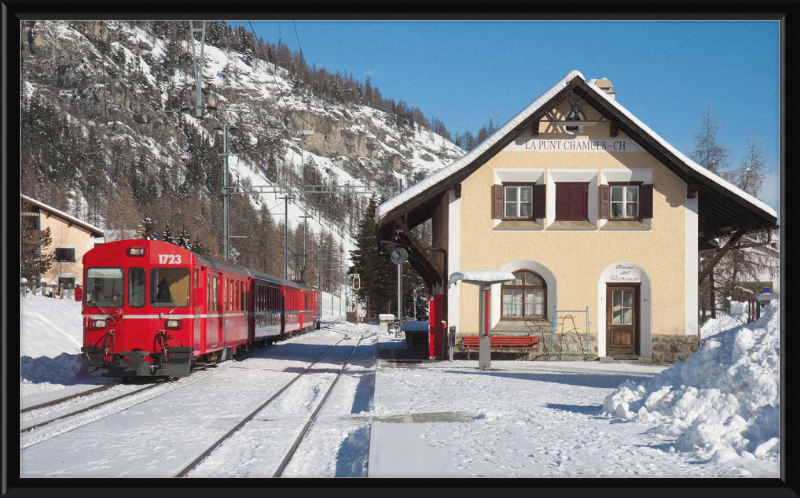 A Train Going Past a Station in Switzerland - Great Pictures Framed