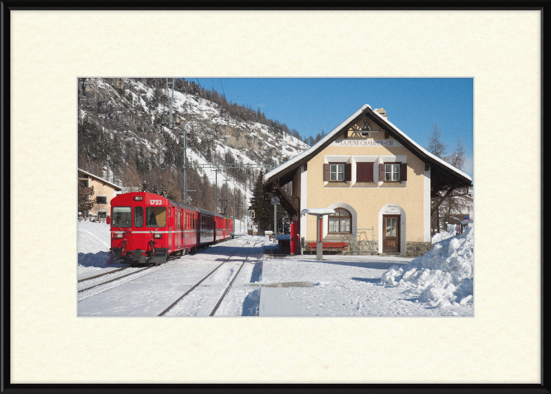 A Train Going Past a Station in Switzerland - Great Pictures Framed
