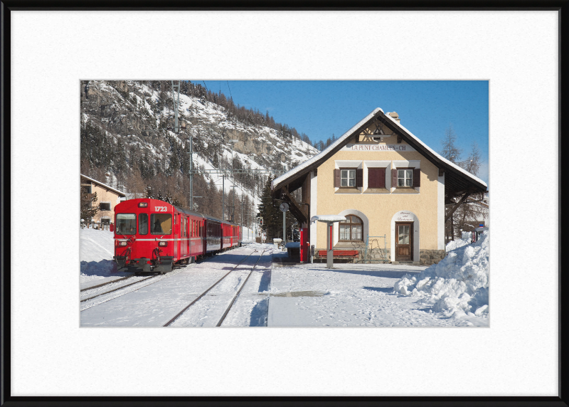 A Train Going Past a Station in Switzerland - Great Pictures Framed