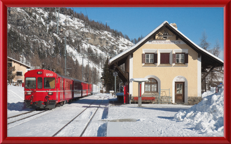 A Train Going Past a Station in Switzerland - Great Pictures Framed