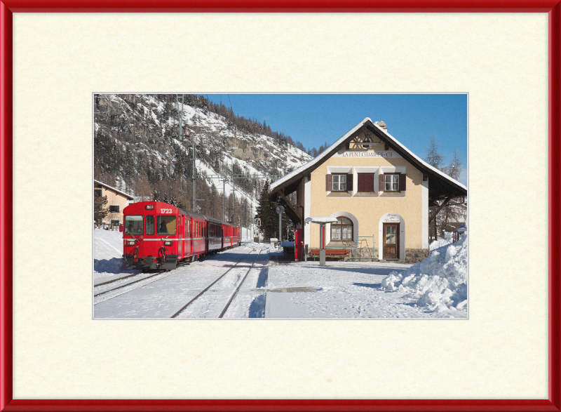 A Train Going Past a Station in Switzerland - Great Pictures Framed
