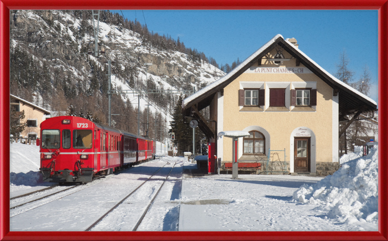 A Train Going Past a Station in Switzerland - Great Pictures Framed