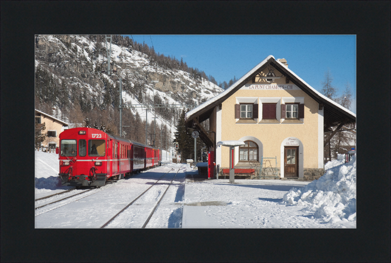 A Train Going Past a Station in Switzerland - Great Pictures Framed