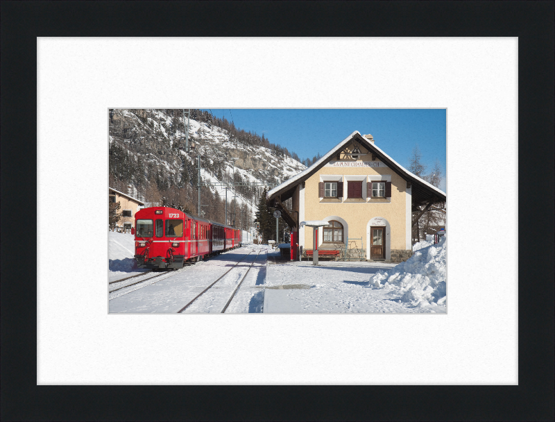 A Train Going Past a Station in Switzerland - Great Pictures Framed