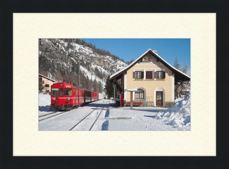 A Train Going Past a Station in Switzerland - Great Pictures Framed