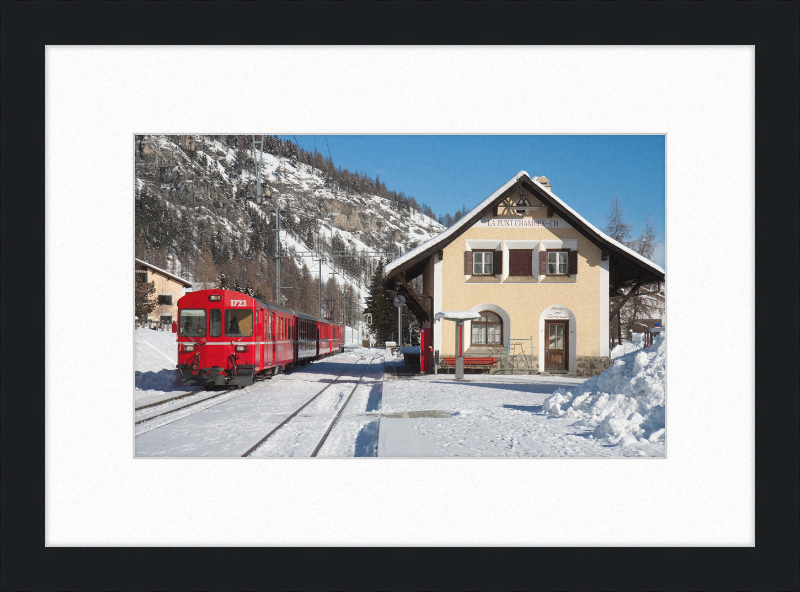 A Train Going Past a Station in Switzerland - Great Pictures Framed