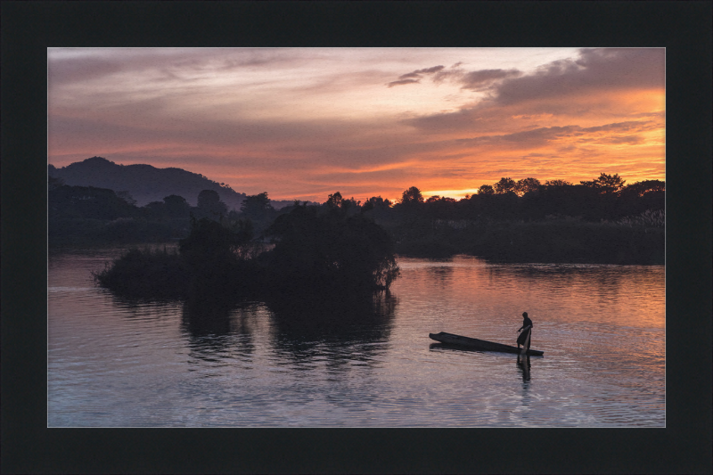 Fisherman Standing on His Pirogue in Laos - Great Pictures Framed
