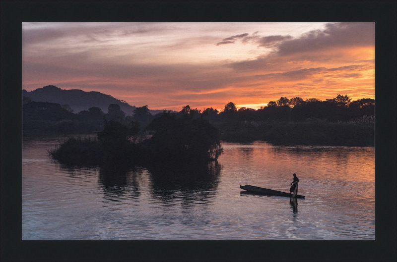 Fisherman Standing on His Pirogue in Laos - Great Pictures Framed