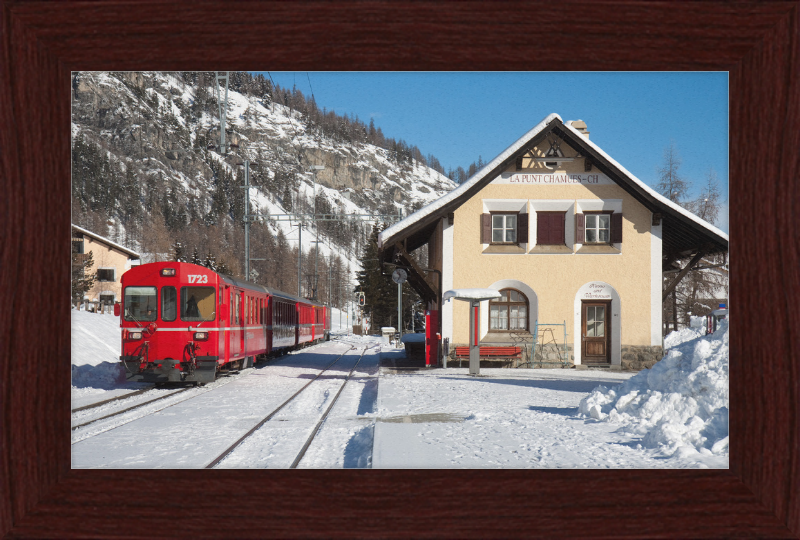 A Train Going Past a Station in Switzerland - Great Pictures Framed