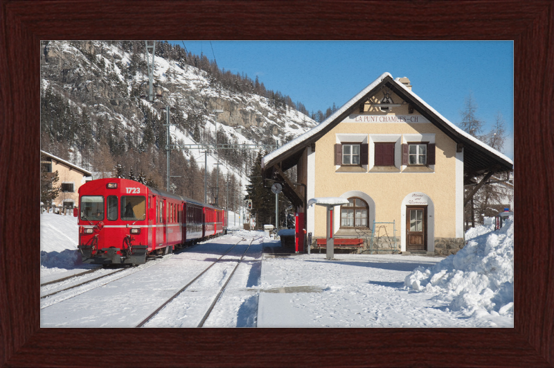 A Train Going Past a Station in Switzerland - Great Pictures Framed