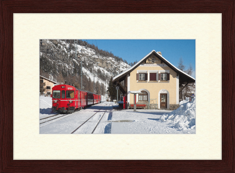 A Train Going Past a Station in Switzerland - Great Pictures Framed