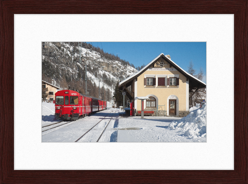 A Train Going Past a Station in Switzerland - Great Pictures Framed