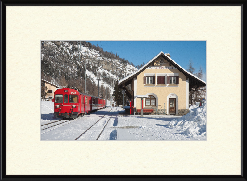 A Train Going Past a Station in Switzerland - Great Pictures Framed