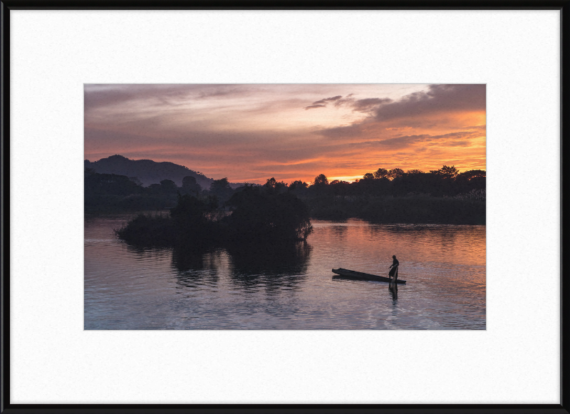 Fisherman Standing on His Pirogue in Laos - Great Pictures Framed