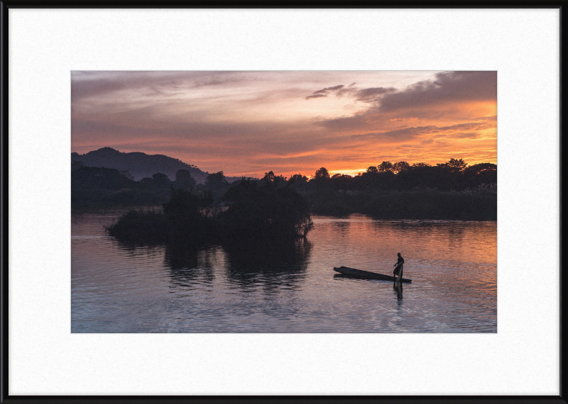 Fisherman Standing on His Pirogue in Laos - Great Pictures Framed