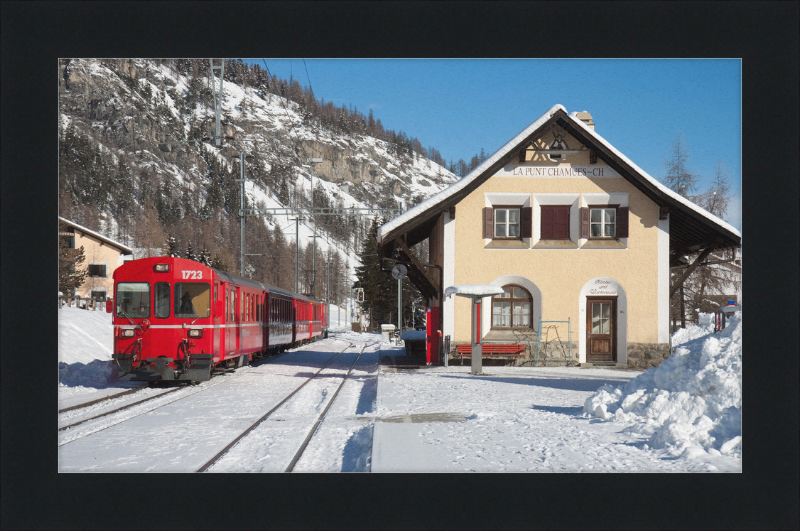 A Train Going Past a Station in Switzerland - Great Pictures Framed